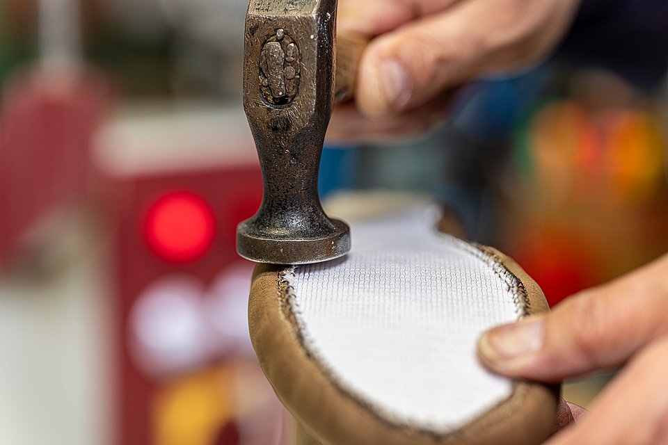 Close-up of the production of a Rieker shoe