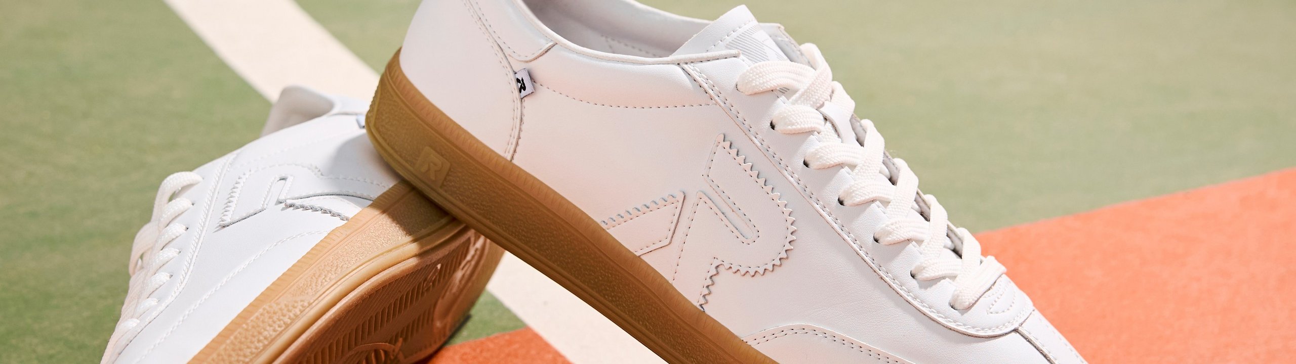 Packshot of sporty sneakers on a basketball court 